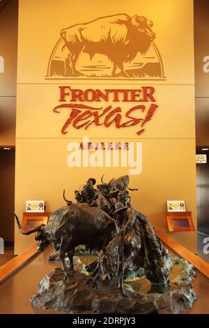 Crossing Catclaw Creek sculpture by T.D. Kelsey located at Frontier! Texas, USA Stock Photo
