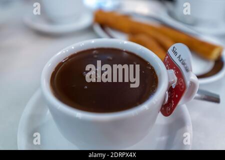 In Spain, it is very typical to have chocolate with churros for breakfast. Stock Photo