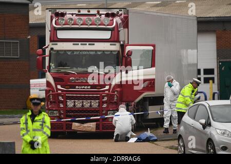File photo dated 23/10/19 of police and forensic officers at the Waterglade Industrial Park in Grays, Essex, after 39 bodies of Vietnamese migrants were found inside the lorry on the industrial estate. Gheorghe Nica, 43, and Eamonn Harrison, 24, have been found guilty at the Old Bailey of the manslaughter of 39 Vietnamese men women and children who suffocated as they were smuggled into Britain in a lorry trailer. The jury, which deliberated for nearly 23 hours, also convicted them of their part in a wider people-smuggling operation with Christopher Kennedy, 24, and Valentin Calota, 38. Stock Photo