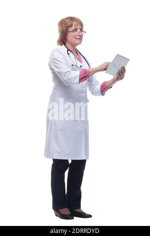 Happy doctor in lab coat and glasses using tablet pc Stock Photo