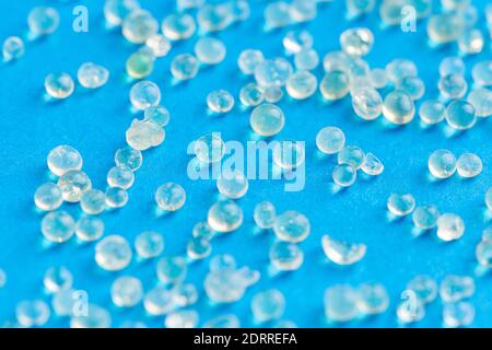 Many white silica gel on blue background Stock Photo