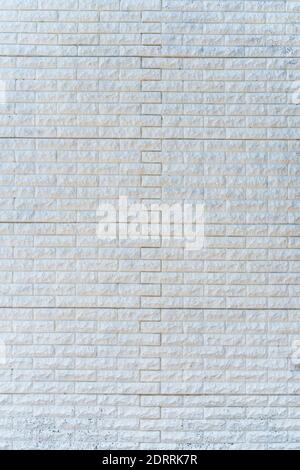 Abstract white brick wall. Textured background. Vertical frame Stock Photo