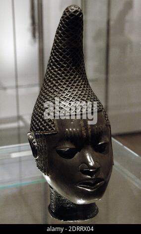 Commemorative head of Queen Mother. Lost-wax cast in brass. life-size female head with curving conical hairstyle covered. Early 16th century. Benin. British Museum. London, England, United Kingdom. Stock Photo