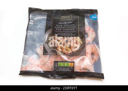 Packet of Argentinian raw peeled red shrimp isolated on a white studio background. Stock Photo