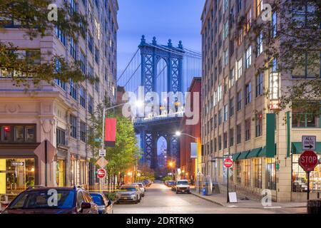 Brooklyn, New York, USA street scene at the Brooklyn Bridge during twilight.