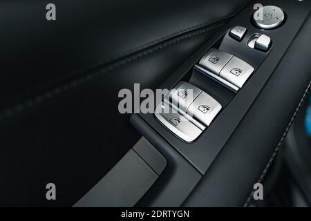 Window lifter button in a luxury car Stock Photo