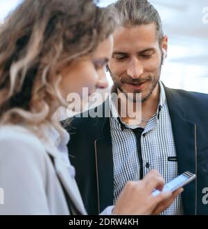 business colleagues discussing something in the subway. Stock Photo