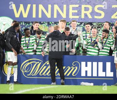 Hampden Park, Glasgow Scotland, UK. 20th Dec, 20. Celtic vs Hearts . Neil Lennon Celtic Manager hands trophy to Leigh Griffiths Credit: eric mccowat/Alamy Live News Stock Photo