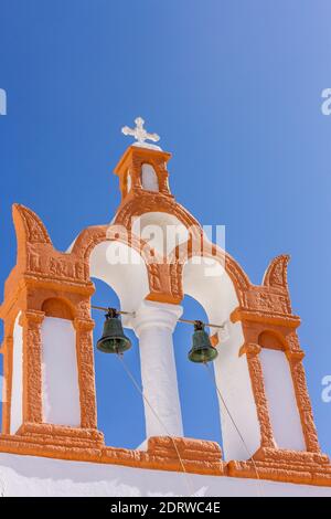 Traditional belfry of a Greek Orthodox chapel in Oia village, Santorini island, Cyclades, Aegean sea, Greece, Europe Stock Photo