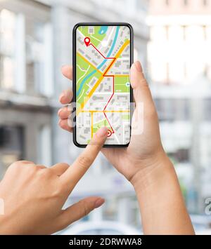 Navigation App With Street Map Opened On Smartphone In Female Hands Stock Photo