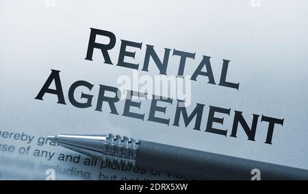 rental agreement form on desktop in business office showing real estate concept. Stock Photo