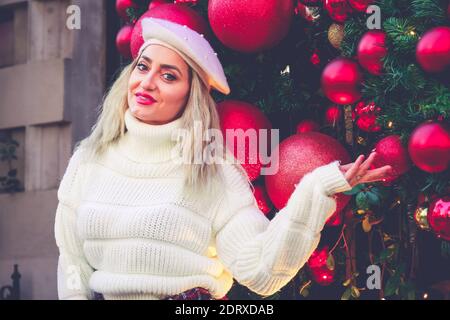 London, UK. 17 Dec 2020. The girl poses in front of Annabel's festive decorations in Mayfair. Credit: Waldemar Sikora Stock Photo