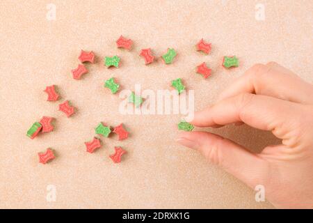 Ecstasy pill in female hand. MDMA assisted psychedelic therapy. Stock Photo