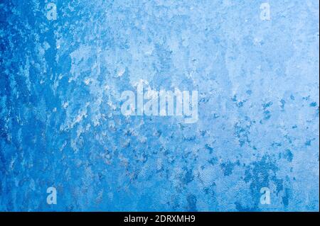Close-up of frost crystals form patterns on a window pane Stock Photo