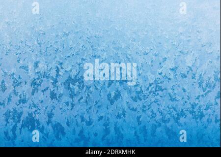 Close-up of frost crystals form patterns on a window pane Stock Photo