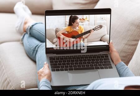 Unrecognizable young woman watching online music lesson, learning how to play guitar on web from home, collage Stock Photo
