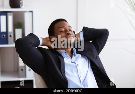 Closeup of relaxed african american businessman resting in office Stock Photo
