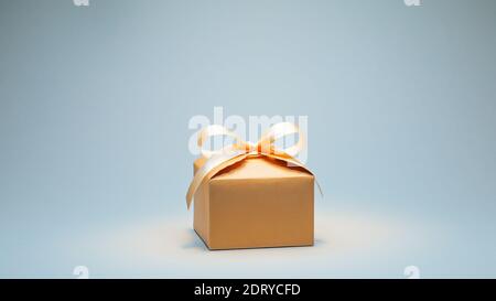 Gift in craft cardboard box with cream ribbon Stock Photo