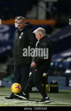 Sammy Lee, the assistant coach of West Bromwich Albion plays with the ball as Sam Allardyce, the manager of West Bromwich Albion looks on. Premier League, West Bromwich Albion v Aston Villa at the Hawthorns in West Bromwich, Midlands on Sunday 20th December 2020. this image may only be used for Editorial purposes. Editorial use only, license required for commercial use. No use in betting, games or a single club/league/player publications. pic by Andrew Orchard/Andrew Orchard sports photography/Alamy Live news
