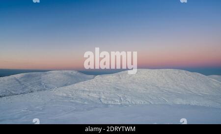 Midwinter landscape in Pallas Yllas National Park of Finnish Lapland. While sun doesn't rise, for few precious hours the light is beautiful.