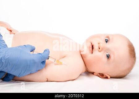 Pediatrician giving a baby boy intramuscular injection. Medicine ...
