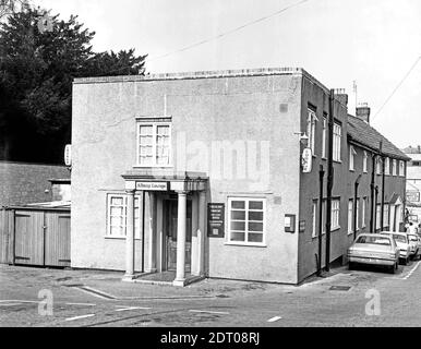 The Duke of York pub in Kingston, Yeovil. Photo taken in 1973. The main pub (see photos b and c) on the main road, was rebuilt in 1905 but this later rear elevation is more box-like. The sign over the door is for The Albany Lounge whereas the menu board advertises the Albany Bar and the perspex hanging sign has been smashed. The gallows sign on the front corner is for 'Lounge, Buffet Bar Car Park at Rear.' There is no brewery signage visible however photos c and d (maybe taken later as on 35mm negatives) show a Bass gallows sign. The nearest car is a Cortina, registration DRB 701L. No0085