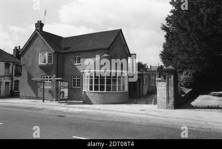 The Duke of York pub in Kingston, Yeovil. Photo possibly taken later than 1973 as not on the original 6x6cm negatives but on 35mm. The main pub shown in this photo, on the main road, was rebuilt in 1905 but there is a later rear elevation, more box-like and shown in other photos. A Bass gallows sign sits over the pavement to the main road. The bus shelter advertisement shows Frankie Howard boasting that Premium Bonds have a maximum prize of £75,000 The pub later became 'Buddys' and later still the Conservative Club once they'd moved from Prince's Street.Duke of York in Yeovil in 1973 0085b