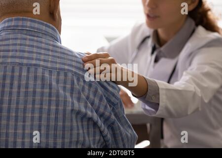 Close up of female doctor support mature patient Stock Photo