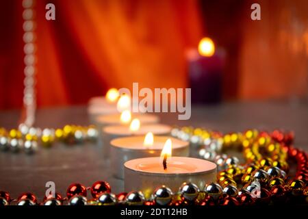 Burning candles on the marble floor. Beautiful background burning candles with place for text Stock Photo