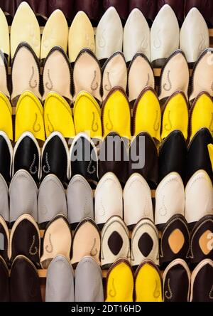 Traditional footwear for sale in the old medina in Fez, Morocco. Stock Photo