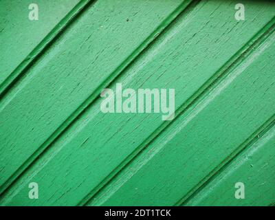 Worn diagonal boards, painted green Stock Photo