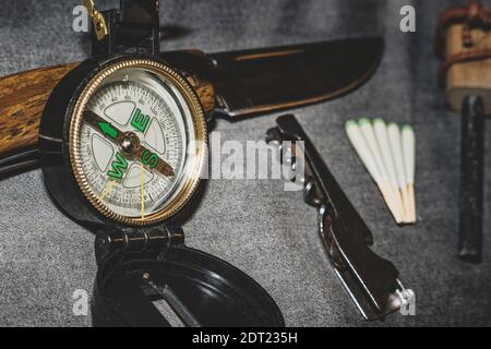 Compass, knife and matches. EDC. Wearable set for survival and tourism Stock Photo