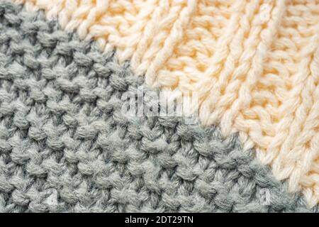 Knitted pattern of threads in two colors and styles. Stock Photo