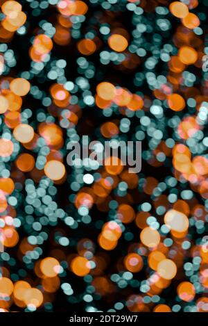 Orange, golden and blue Blurred lights background. Defocused glitter background. New year or Christmas background Stock Photo
