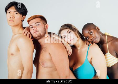 Young people leaning on each other Stock Photo