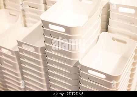 Stacked empty plastic box. folded plastic containers at store Stock Photo