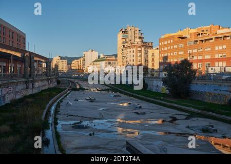 Looking north up the dry River Guadalmedina running through the centre of Malaga, Andalusia, Spain. Stock Photo