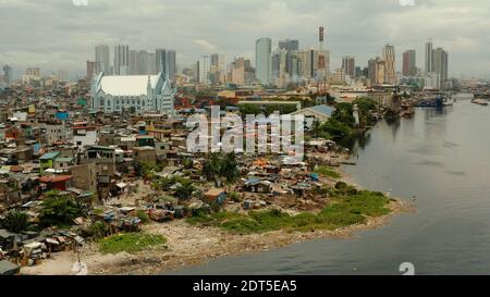 Manila is the capital of the Philippines with slums and poor district and skyscrapers and modern buildings. Stock Photo