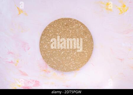 Round cork heat pot stand for cooking on pink Stock Photo