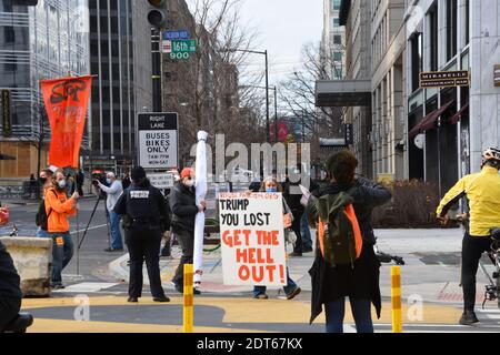 Washington DC. December 12, 2020. March for Trump. Far-left protesters holding political sign against President Trump on the 16th street. Stock Photo