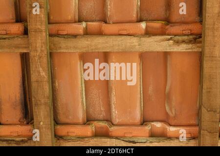 Shingles and wooden slats texture. View from under the roof. Stock Photo