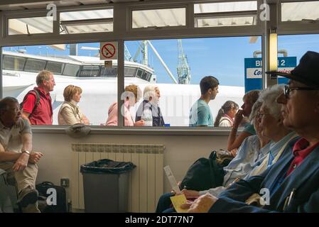 Passengers arriving and waiting at St Peter Port harbour on Guernsey UK Stock Photo