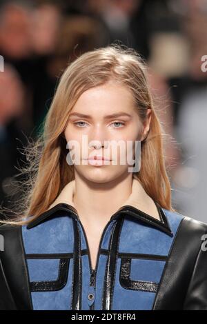 A model displays a creation by designer Nicolas Ghesquiere for Louis  Vuitton Fall-Winter 2014/2015 Ready-To-Wear collection show held at Cour  Carree du Louvre in Paris, France, on March 05, 2014. Photo by