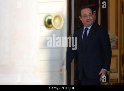 President Francois Hollande leaves the weekly cabinet meeting at the Elysee presidential Palace, in Paris, France, on March 5, 2014. Photo by Christian Liewig Stock Photo
