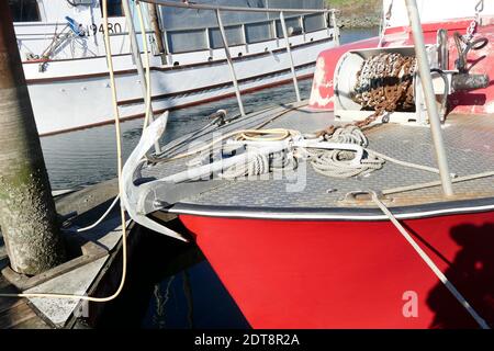 NEWPORT, OREGON - NOV 21, 2019  -Block and tackle for rigging and anchor on fishing boat in the Yaquina marina,  Newport, Oregon Stock Photo