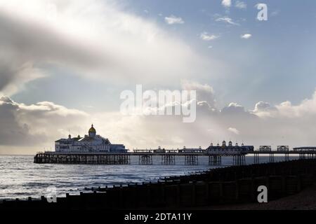 EASTBOURNE, ENGLAND - 20th  DECEMBER 2020: Eastbourne pier on a cloudy and rainy winter afternoon Stock Photo