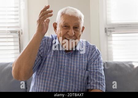 Portrait of smiling mature man talk on video call Stock Photo