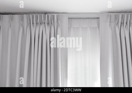 Two layers curtain with rails, installed on ceiling, translucent and blocking lights curtain Stock Photo