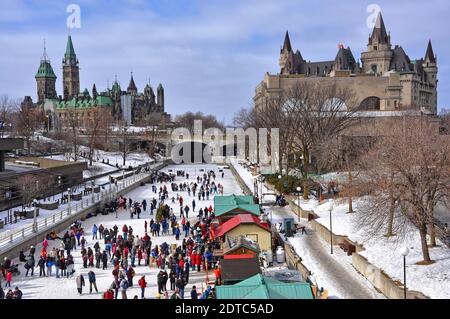 Ottawa, Canada - February 14, 2010:  People celebrate the Winterlude festival in Canada's capital on the world's largest outdoor skating rink.  The Pa Stock Photo