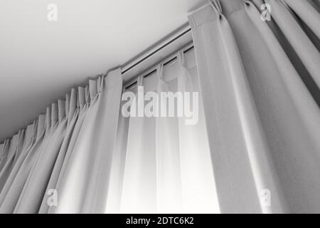 Two layers curtain with rails, installed on ceiling, translucent and blocking lights curtain Stock Photo